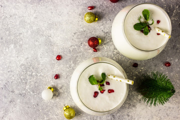 White Christmas cocktail coconut Mojito drink on festive background