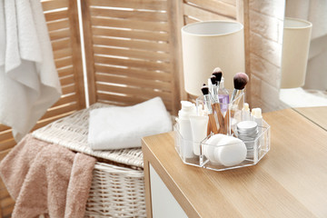 Organizer with cosmetic products and space for text on dressing table