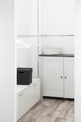 Dressing room with chest of drawers and rack for clothes