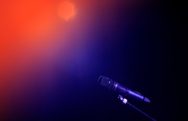 Closeup of microphone in concert hall or conference room