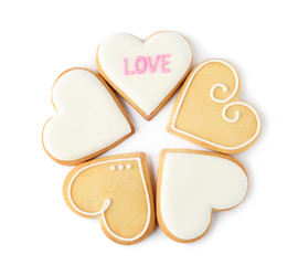 Decorated heart shaped cookies on white background, top view. Valentine's day treat