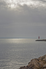 Fototapeta premium Ocean view with pier sailboat and horizon