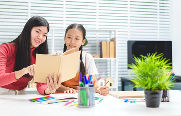 Education family doing homework young and grand sister lesson practice preparing exam.