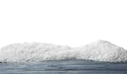 Wooden surface covered with snow against white background