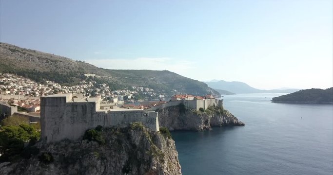Fort Lovrijenac in Dubrovnik, the camera rises slowly to reveal old town in the distance and the coast in the distance