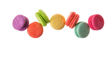 Flat lay, top view. Close up. Sweet macaroons isolated on white background. Copy space below.