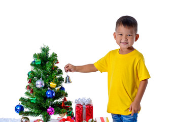 Happy asian child holding little bell for decoration Christmas tree. Christmas or happy newyear time