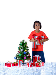 Happy asian child holding Christmas presents. Christmas or happy newyear time