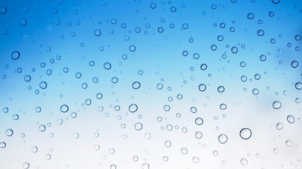 Fototapeta na wymiar Abstract Water drops on blue glass Background - Image