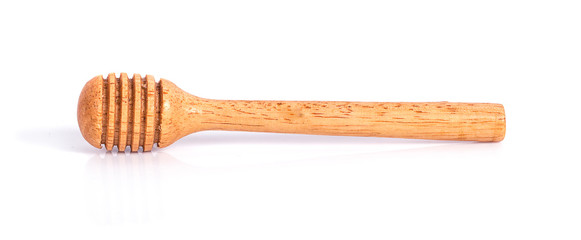 Honey dipper or spoon made from wooden isolated on white background