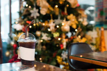 ice black coffee and bokeh lighting in christmas holidays