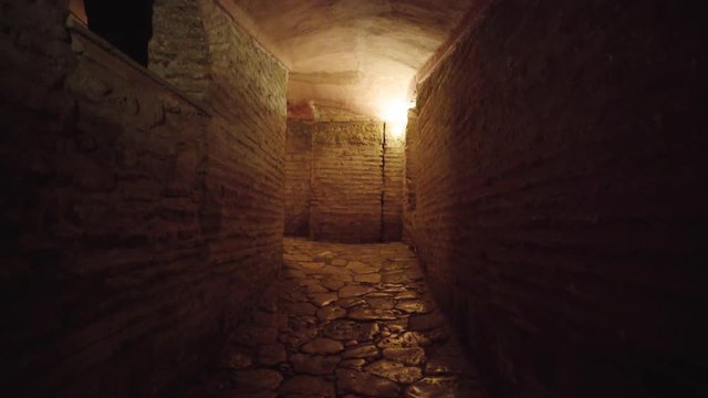 Walking through stone catacomb tunnels in Istanbul