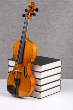 Still-life with a pile of books and a violin