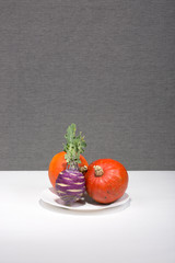 Still life with pumpkins and kohlrabi cabbage
