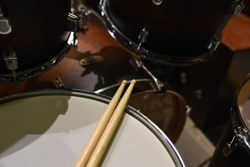 Closeup of drumsticks lying on the professional drum set. Drummer equipment. 