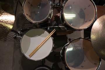 Closeup of drumsticks lying on the professional drum set. Drummer equipment. 