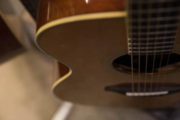 Closeup macro of abstract acoustic guitar and strings with copy space for text