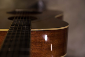 Fototapeta premium Closeup macro of abstract acoustic guitar and strings with copy space for text