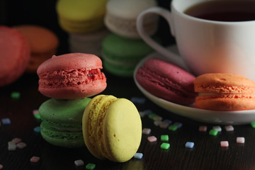 Bright macaroons against dark background