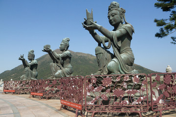Obraz premium Color, daytime landscape photo of three bodhisattva sculptures at the Po Lin Monastery, Lantau Island, Hong Kong, China. 