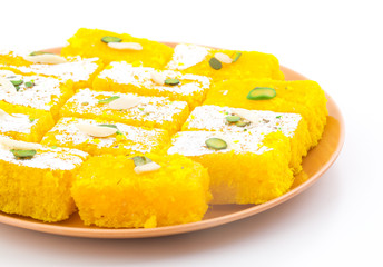 Indian Popular Sweet Food Khopara Pak or Coconut Burfi made up of Coconut, Milk And Sugar Isolated on White Background