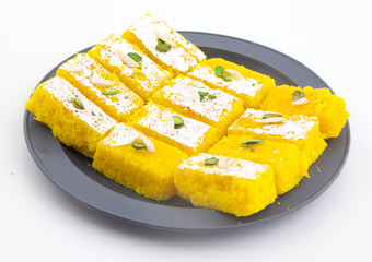 Indian Popular Sweet Food Khopara Pak or Coconut Burfi made up of Coconut, Milk And Sugar Isolated on White Background