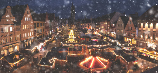 view from top of a building to the entire Christmas Market in Pfaffenhofen Germany with red light...
