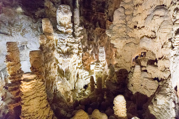 Giant Stalactite and Stalagmite Formations into the Cave at Frasassi Caves, Marche, Italy