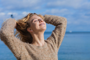 Happy woman outdoor wearing jumper