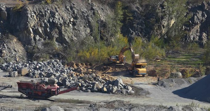 Big yellow dump truck in a quarry, excavator and dump truck quarry, industrial dump truck in a quarry