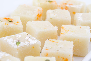 Indian Popular Sweet Food Khopara Pak or Coconut Burfi made up of Coconut, Milk And Sugar Isolated on White Background