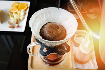 drip coffee barista filtered coffee drip brewing on tray wooden black table cafe shop