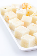 Indian Popular Sweet Food Khopara Pak or Coconut Burfi made up of Coconut, Milk And Sugar Isolated on White Background