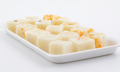 Indian Popular Sweet Food Khopara Pak or Coconut Burfi made up of Coconut, Milk And Sugar Isolated on White Background