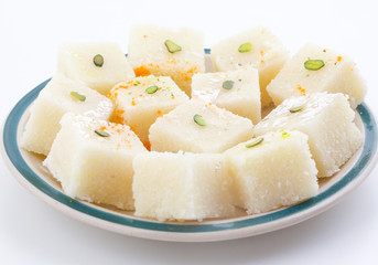 Indian Popular Sweet Food Khopara Pak or Coconut Burfi made up of Coconut, Milk And Sugar Isolated on White Background