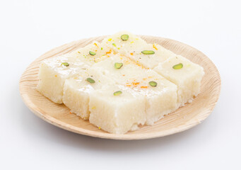 Indian Popular Sweet Food Khopara Pak or Coconut Burfi made up of Coconut, Milk And Sugar Isolated on White Background