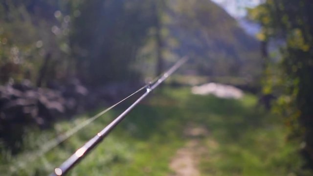 Walking with a fishing rod in the hand (60 fps POV)