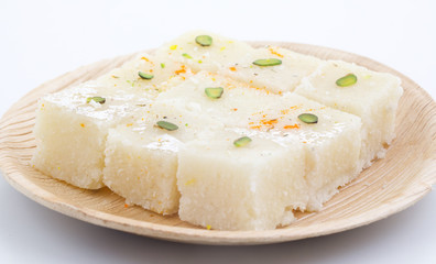 Indian Popular Sweet Food Khopara Pak or Coconut Burfi made up of Coconut, Milk And Sugar Isolated on White Background