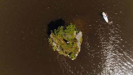 Vertical drone shot of paddle boarder in Glenelg River, Nelson, Australia.