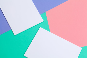 Pile of colorful and white blank sheets of paper for your design, top view flat lay