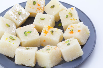 Indian Popular Sweet Food Khopara Pak or Coconut Burfi made up of Coconut, Milk And Sugar Isolated on White Background