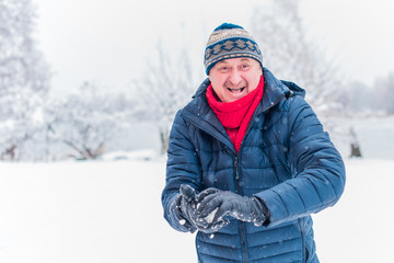 Fototapeta na wymiar Senior man on a walk. Positive lifestyle and life after 50 -60 year. Good mood and holiday joyful 