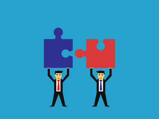 Fototapeta premium businessman raised jigsaw puzzle,business teamwork concept