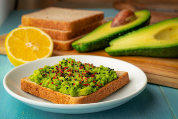 Avocado toast made from bran bread with black sesame and chili pepper