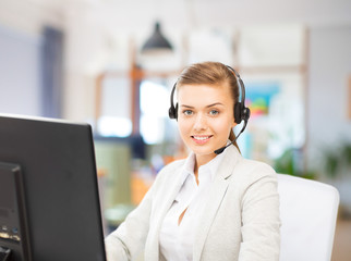 business, technology and communication concept - female helpline operator in headset working at...