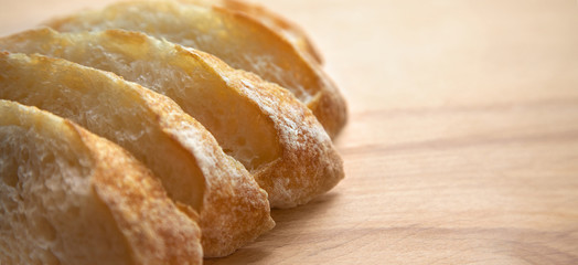 Sliced bread on a wooden table.