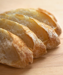 Sliced bread on a wooden table.
