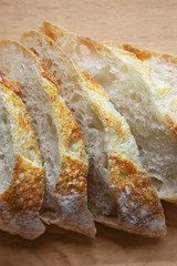 Sliced bread on a wooden table.