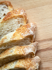 Sliced bread on a wooden table.