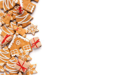 Christmas background with homemade gingerbread cookies and small gifts